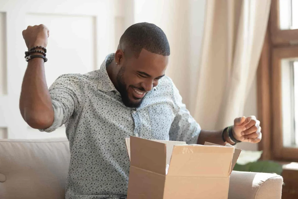 Man who is excited abou receiving his shipment in the mail